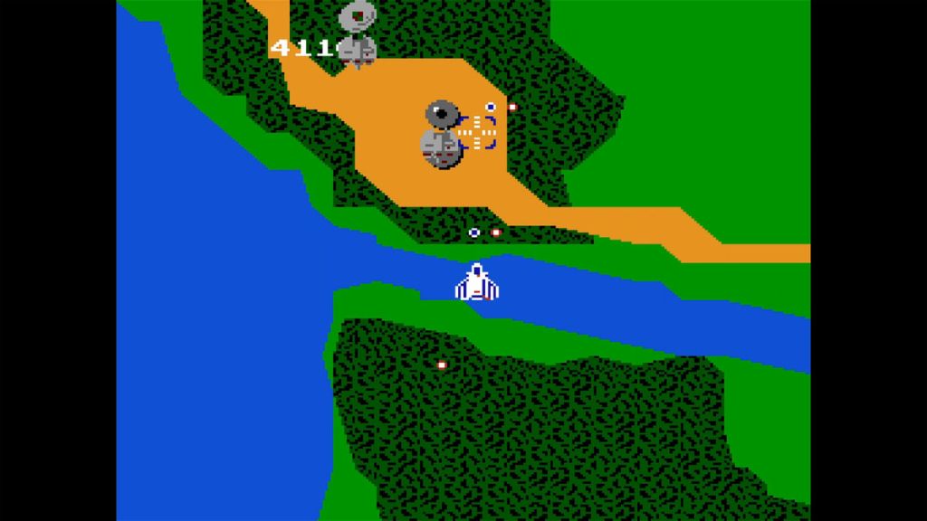 Xevious - Watch out, the circular turret on the ground is about to fire! Good thing I can destroy them with my blaster (bombs)!